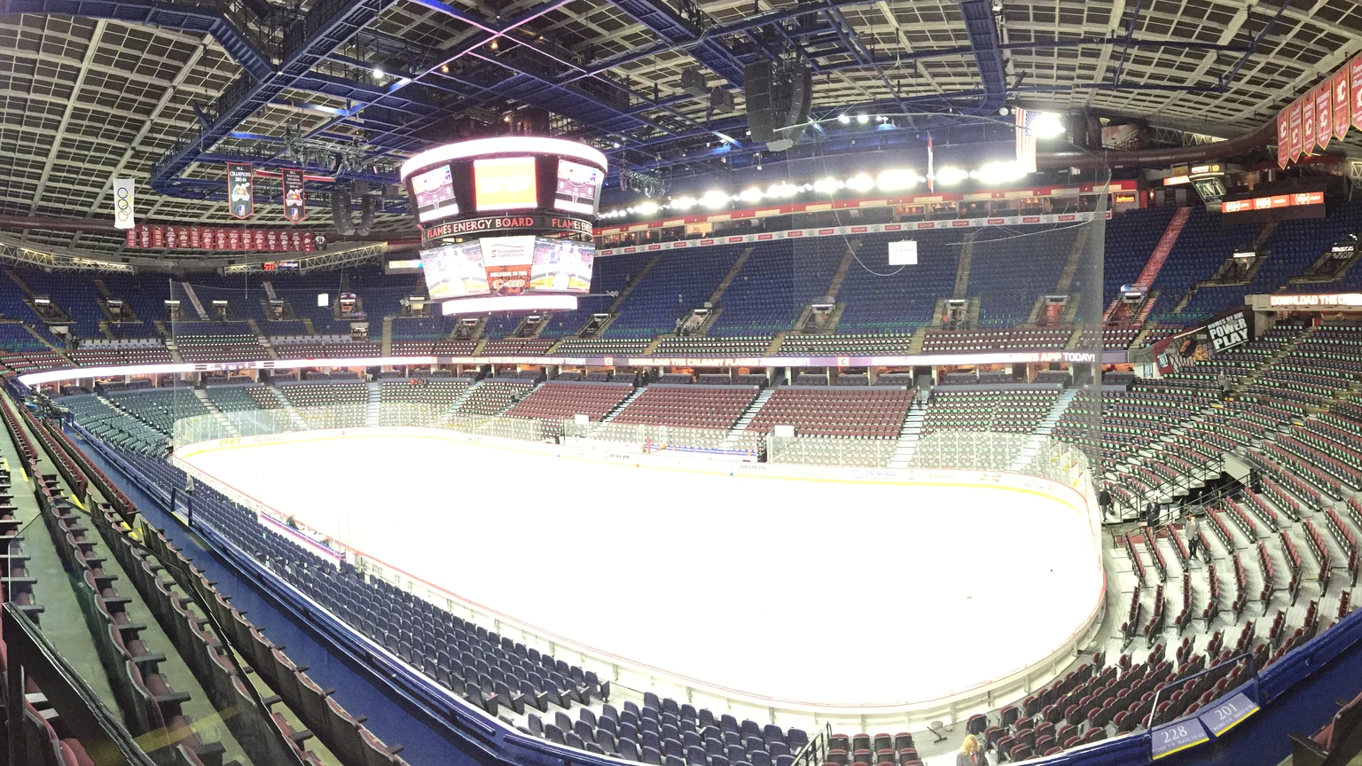 Wide interior view of the seating bowl and ice inside Scotiabank Saddledome